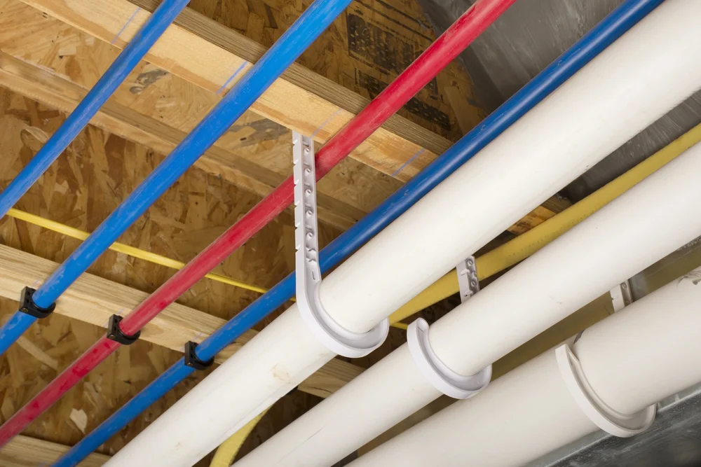 Plumber removing old galvanized pipes during a repipe in Oceanside, CA